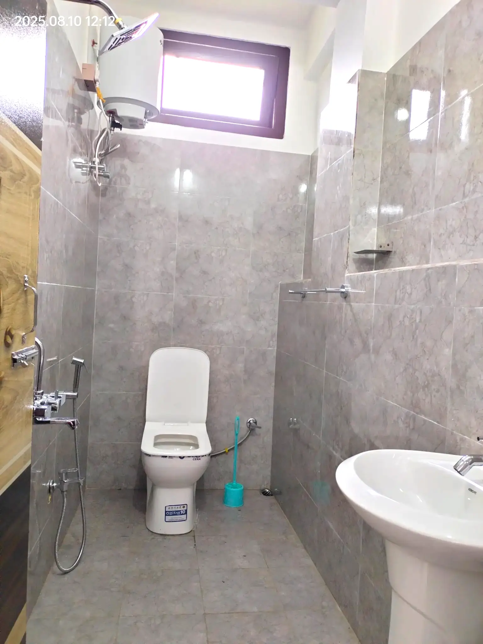 Modern bathroom with geyser and hot water