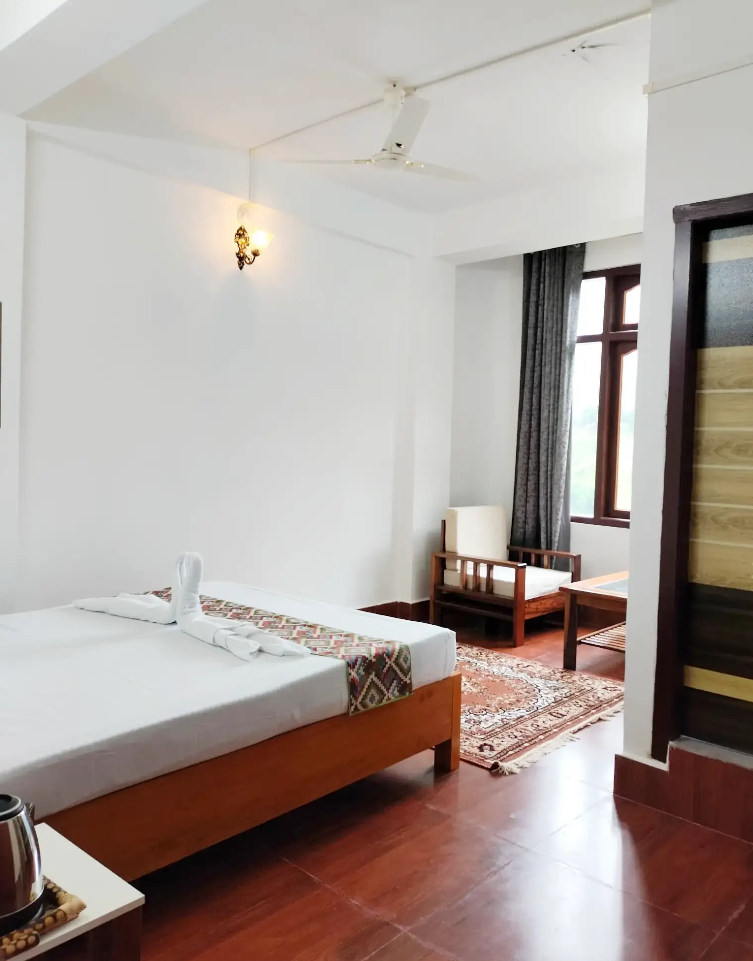 Spacious double bed room with monastery view and modern amenities